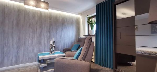 Graues Wohnzimmer - wie kann es dekoriert werden?